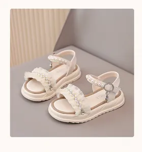 Elegant beige girls' princess sandals featuring exquisite pearl and ruffle detailing for summer