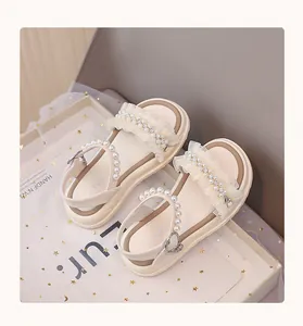Top view of cream girls' princess sandals featuring elegant pearl and lace embellishments.