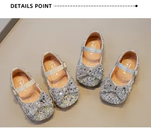 Detailed view of girls' sparkly rhinestone princess shoes with elegant bows