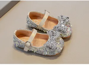 Sparkling silver sequined princess shoes for girls with large bow detail