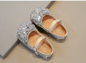 Detailed top view of silver sequined princess shoes for toddler girls.