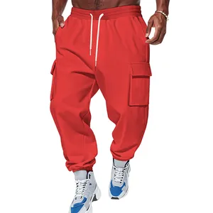 Close-up detail of men's red heavy cargo pants with multi-pockets and drawstring