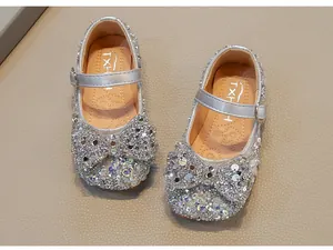 Silver sparkling rhinestone girls princess shoes with large bow and Mary Jane strap.