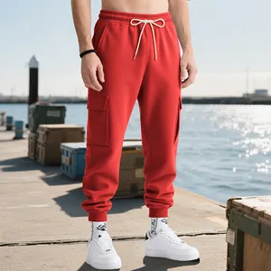 Close-up view of men's red heavyweight cargo sweatpants featuring large side pockets