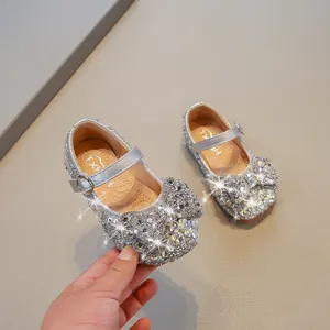 Sparkly silver girls' Mary Jane princess shoes with sequins and rhinestone bow detail