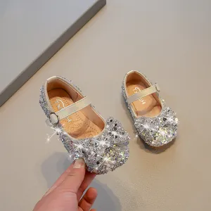 Sparkly silver girls' princess shoes with rhinestones and elegant bow detail for performance
