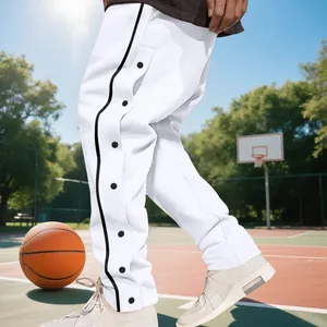 Side view of white men's basketball tear-away pants with black stripe and snap buttons.