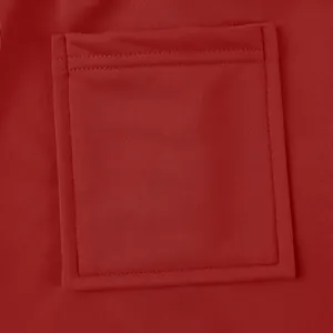 Detailed macro view showing the sturdy stitching on a square pocket of red cargo pants