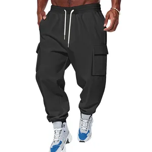 Close-up detail of men's heavyweight black cargo pants featuring multi-pockets and drawstring