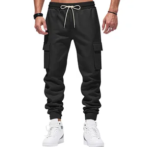 Detailed view of men's heavyweight black cargo sweatpants with drawstring waist.
