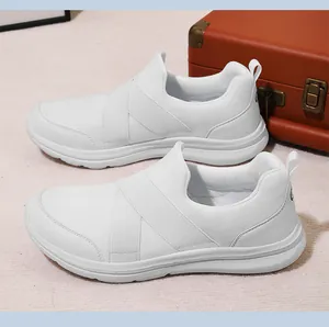 Detailed side view of white breathable mesh slip-on sneakers with elastic straps