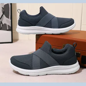 Lightweight mesh slip-on sneakers for men featuring breathable fabric and cross elastic straps.
