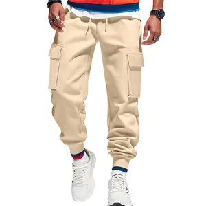 Close-up of men's beige multi-pocket cargo joggers with ribbed cuffs for winter