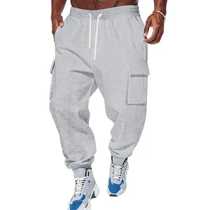 Detail shot of grey men's cargo sweatpants featuring elastic drawstring waist and side pockets.
