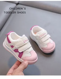Detail view of pink and white breathable toddler shoes with double velcro straps