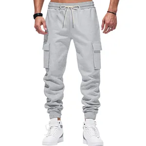 Close-up view of grey men's cargo joggers featuring drawstring waist and side flap pockets