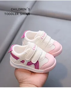 Detail view of pink and white breathable mesh toddler walking shoes with soft soles.
