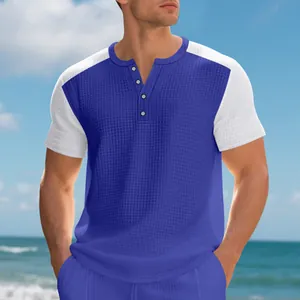 Detailed view of men's waffle knit Henley shirt with blue and white color block design