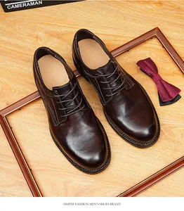 Detail view of vintage horse leather Goodyear welted derby shoes with a burgundy bowtie.