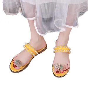 Yellow flat sandals with pearl straps and rhinestone pineapple decoration for beach wear