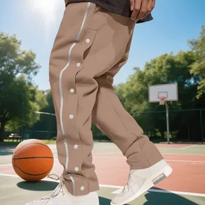 Detail view of men's heavyweight tear-away basketball sweatpants with side buttons.