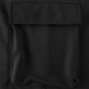Detailed close-up of the durable flap pocket on men's heavy black cargo pants.