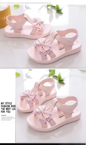 Sandalias rosas para niñas con lazo y pedrería para la temporada de verano de 2025