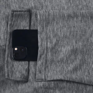 Close-up view of a spacious side pocket on grey cotton cargo sweatpants for men