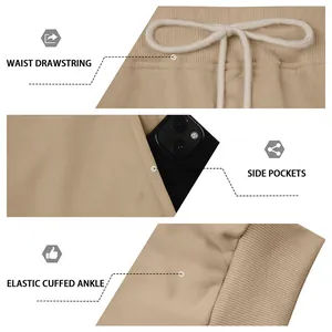 Detail view of men's cargo joggers showing drawstring waist, side pockets, and elastic cuffs