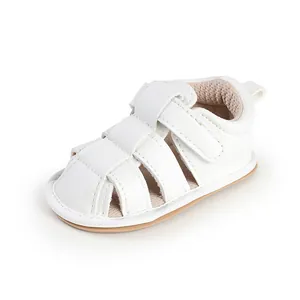 Detailed view of white breathable baby walker sandals with hook and loop closure