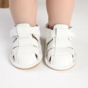 Macro view of white breathable baby sandals with soft sole and hook loop closure