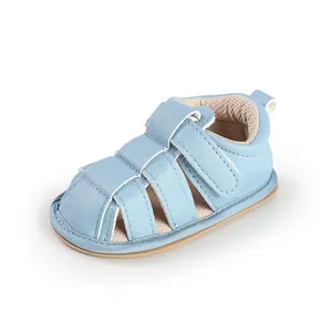 Close-up of light blue breathable baby sandals with soft soles and hook-and-loop straps