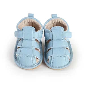 Top-down view of light blue baby sandals with breathable cutout design and velcro strap.