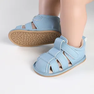 Close-up of light blue breathable baby sandals with non-slip sole and hook-and-loop strap