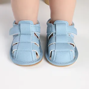 Front view of light blue baby soft sole sandals for infant pre-walkers on feet