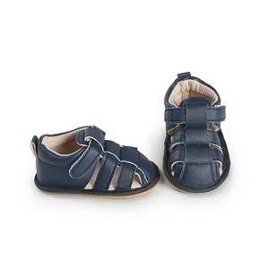 Close-up of navy blue breathable baby walking sandals for toddlers on white background