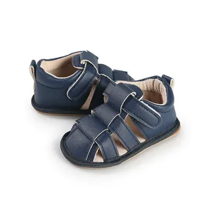 Detailed side and top view of navy blue breathable baby sandals for toddlers' first steps.