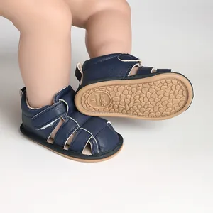 Detail view of navy blue breathable baby walking sandals with textured anti-slip sole