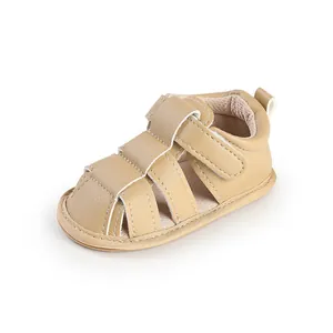 Close-up detail of beige breathable baby sandals with soft leather and velcro strap