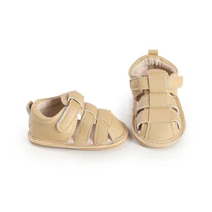 Detail view of beige breathable baby sandals with soft soles and velcro straps