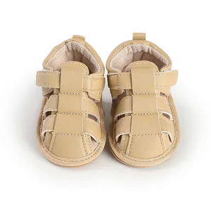 Front view of beige infant sandals featuring breathable multi-strap leather design