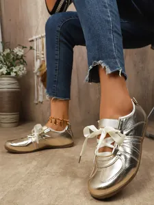 Metallic gold German Army sneakers with white ribbon laces for a vintage casual look