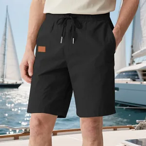 Détails du short de plage noir respirant pour homme avec taille à cordon et poches