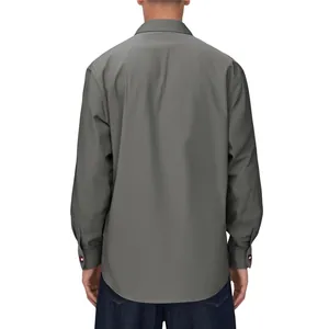 Back view of a solid color men's casual long-sleeved shirt with a stylish stand collar.