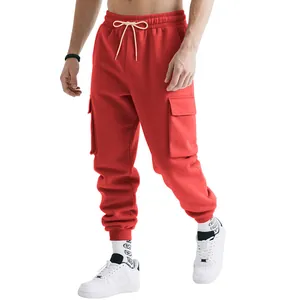 Detail of men's red heavy cargo sweatpants with multi-pockets and drawstring waist.