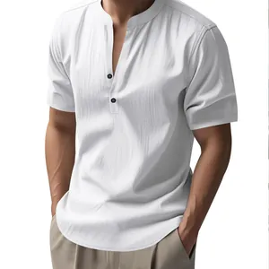Detailed view of the white linen shirt showing textured fabric and stand collar design