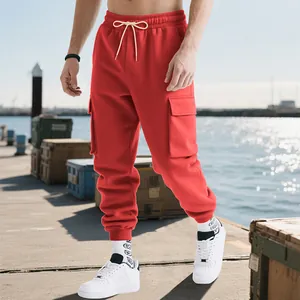 Detail view of men's red heavy-duty cargo sweatpants with multiple utility pockets.