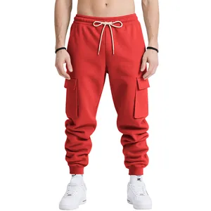 Detail of red heavy-duty men's cargo pants with drawstring and multiple pockets
