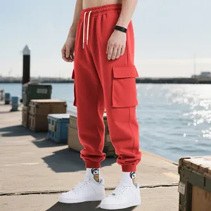 Detailed view of red heavy-weight men's cargo sweatpants with large side pockets
