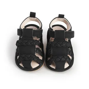High-quality detailed view of black breathable baby summer sandals with braided straps